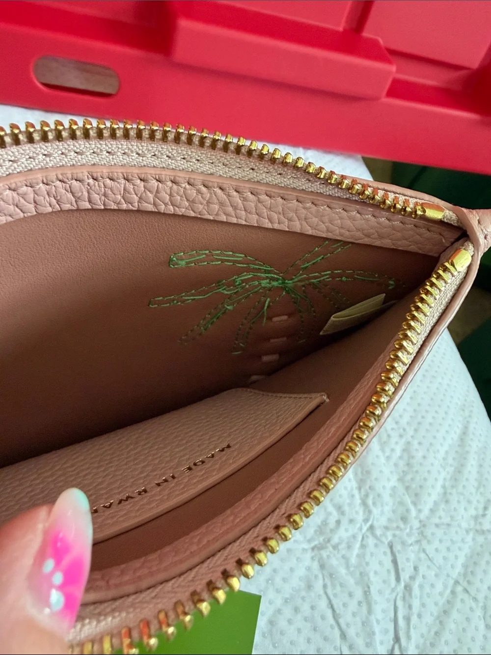 kate spade pink leather wristlet with green palm applique